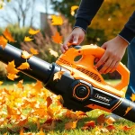Electric leaf blower efficiently clearing colorful autumn leaves in a sunny garden.