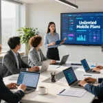 Team collaborating on unlimited business mobile plans in a modern office setting, showcasing teamwork and professionalism.